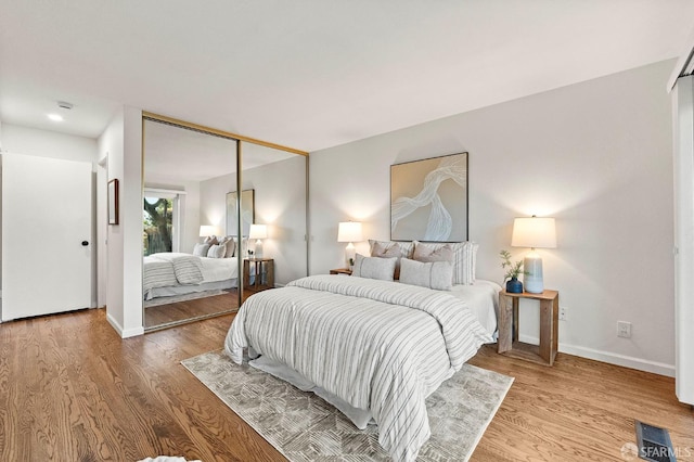 2811 Bayview Dr, Alameda, CA 94501 - bedroom featuring wood finished floors, baseboards, and a closet