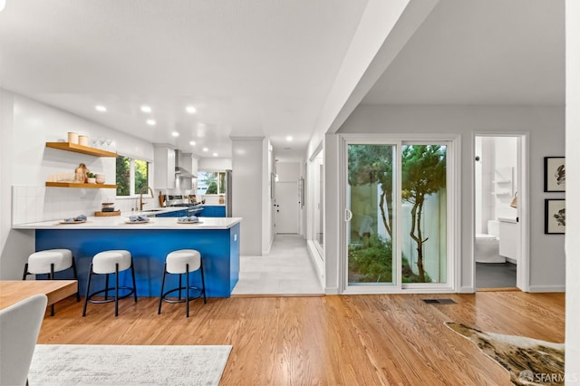 2811 Bayview Dr, Alameda, CA 94501 - kitchen featuring a sink, light countertops, open shelves, a kitchen breakfast bar, and recessed lighting