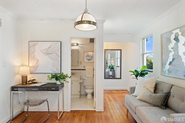 interior space with hardwood / wood-style floors and crown molding