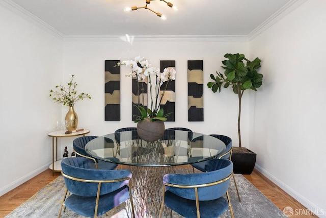 dining area featuring crown molding and hardwood / wood-style floors