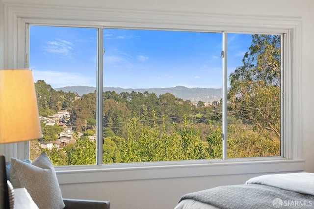 bedroom featuring a mountain view