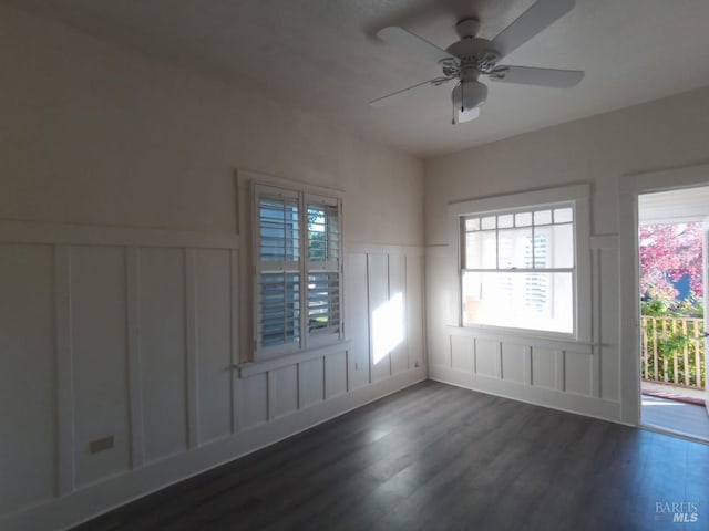 empty room featuring dark hardwood / wood-style floors and ceiling fan