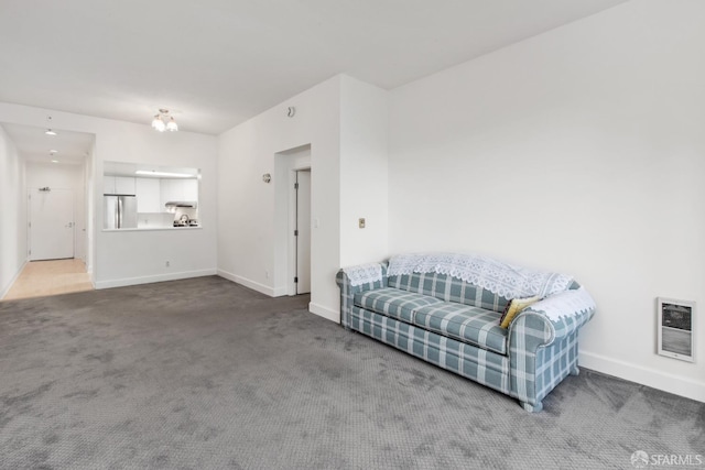 living room featuring carpet flooring and heating unit