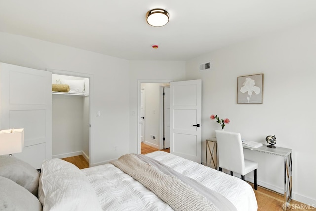 1204-1206 Funston Ave, San Francisco, CA 94122 - bedroom featuring light wood-type flooring and a walk in closet