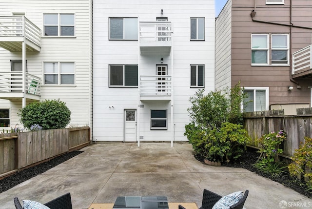1204-1206 Funston Ave, San Francisco, CA 94122 - rear view of house with a fenced backyard and a patio