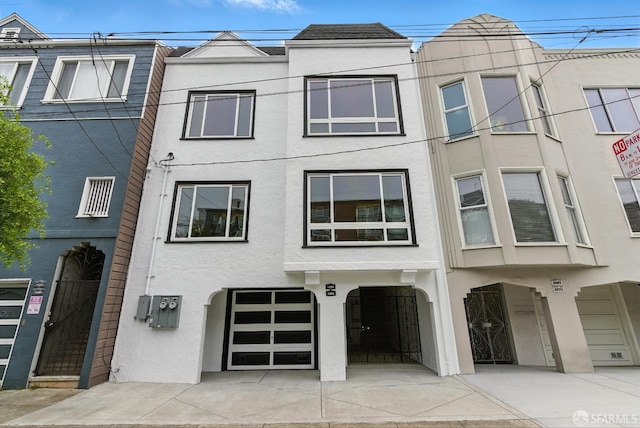 1204-1206 Funston Ave, San Francisco, CA 94122 - view of front of property with stucco siding and an attached garage