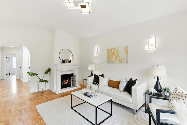 1204-1206 Funston Ave, San Francisco, CA 94122 - living room featuring lofted ceiling, arched walkways, ornamental molding, and a warm lit fireplace