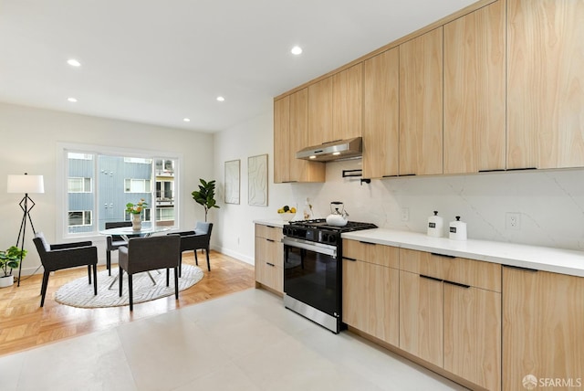 1204-1206 Funston Ave, San Francisco, CA 94122 - kitchen featuring gas range, light brown cabinetry, under cabinet range hood, modern cabinets, and light countertops