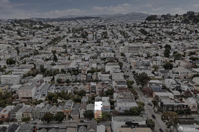 birds eye view of property with a mountain view