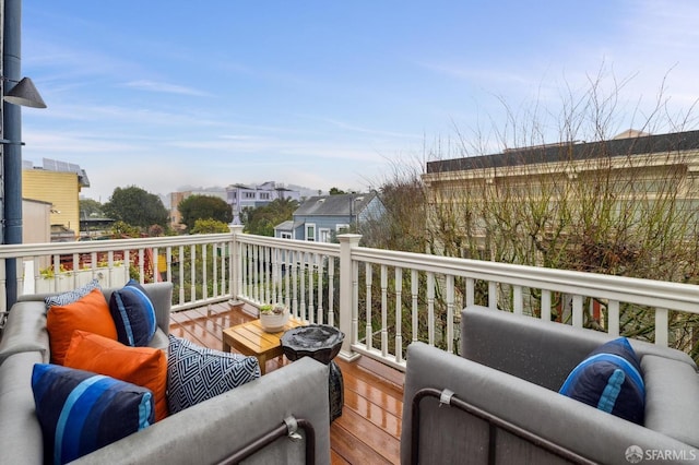 wooden deck featuring an outdoor living space