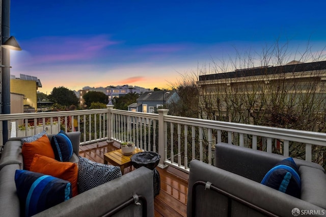 wooden balcony featuring an outdoor hangout area and a deck