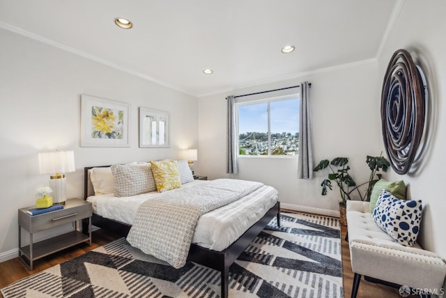 bedroom with ornamental molding, dark wood-style flooring, recessed lighting, and baseboards