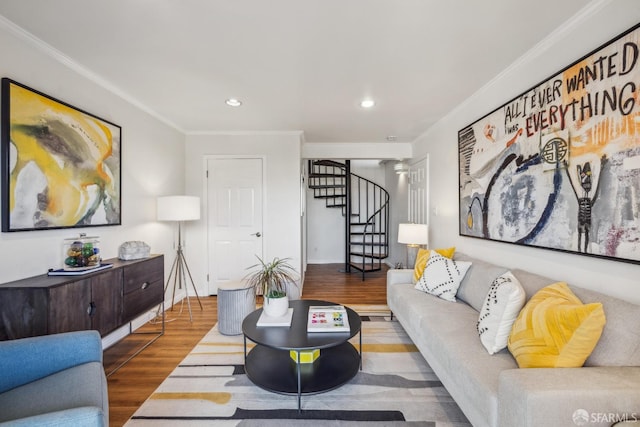 living room with ornamental molding, recessed lighting, stairs, and wood finished floors