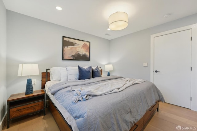 bedroom with light hardwood / wood-style floors