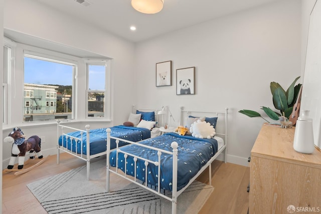 bedroom with light hardwood / wood-style flooring