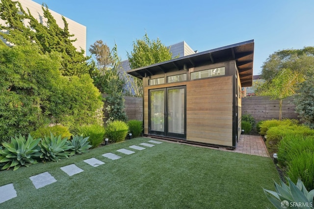 view of outdoor structure featuring a yard