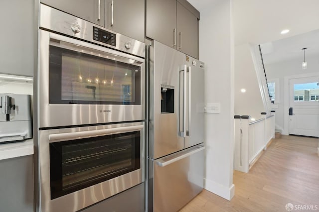 kitchen featuring light hardwood / wood-style flooring and appliances with stainless steel finishes