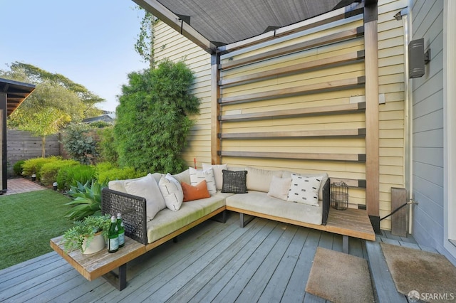 wooden terrace with outdoor lounge area