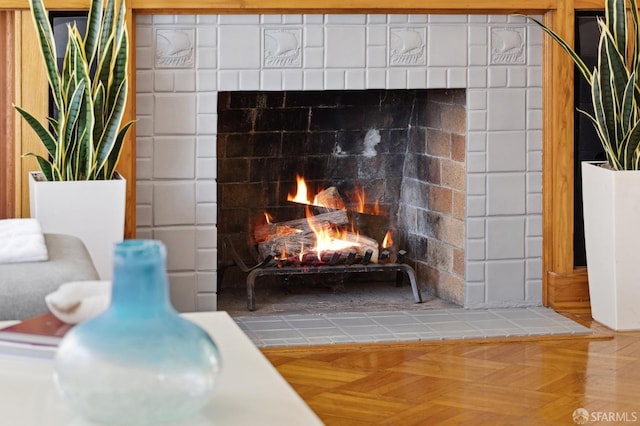 interior details featuring parquet floors and a fireplace