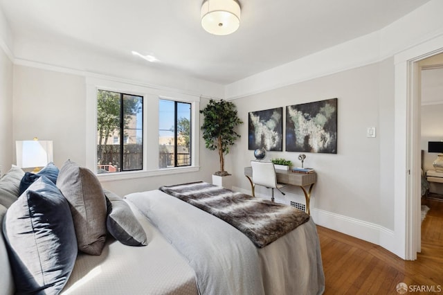 bedroom with hardwood / wood-style floors