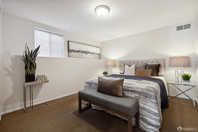 bedroom with dark carpet