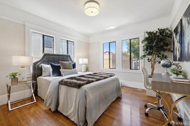 bedroom featuring wood-type flooring