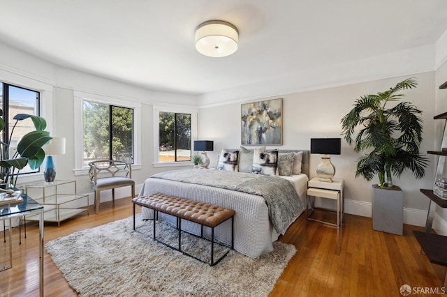 bedroom with wood-type flooring