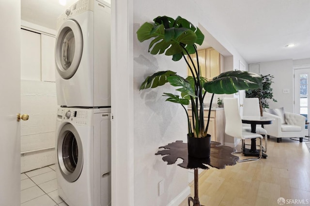 washroom with stacked washer / dryer