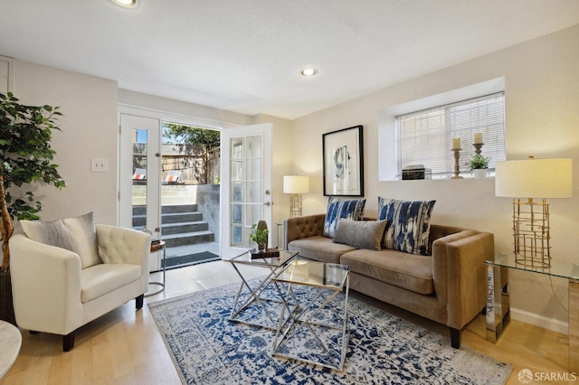 living room with light hardwood / wood-style flooring