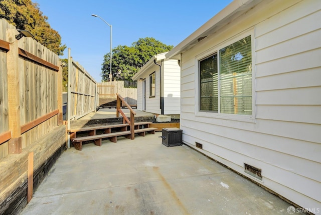 view of patio / terrace with fence and a wooden deck