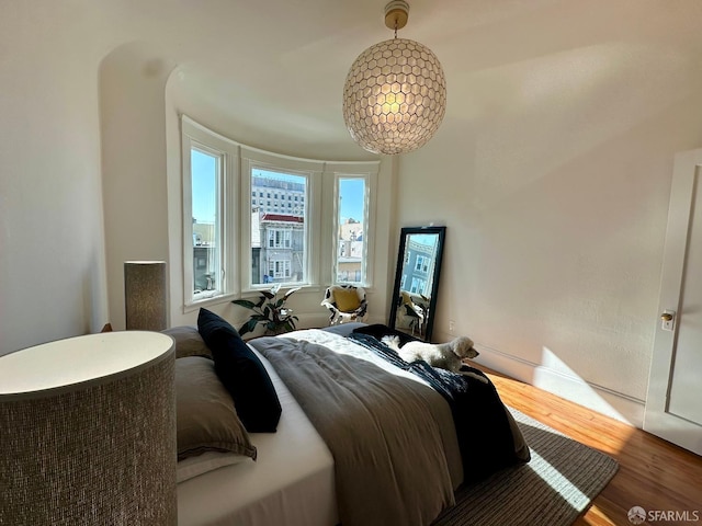 bedroom with hardwood / wood-style flooring