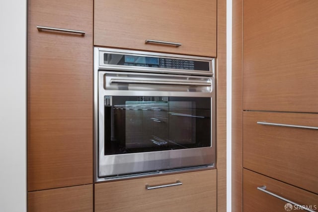 301 Mission St Unit 39A, San Francisco, CA 94105 - kitchen view of stainless steel oven and dark countertops