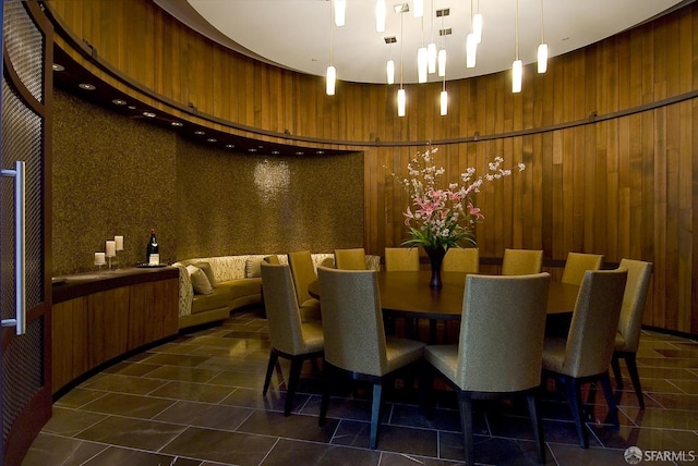 301 Mission St Unit 39A, San Francisco, CA 94105 - dining room with wood walls, dark tile patterned floors, and a high ceiling
