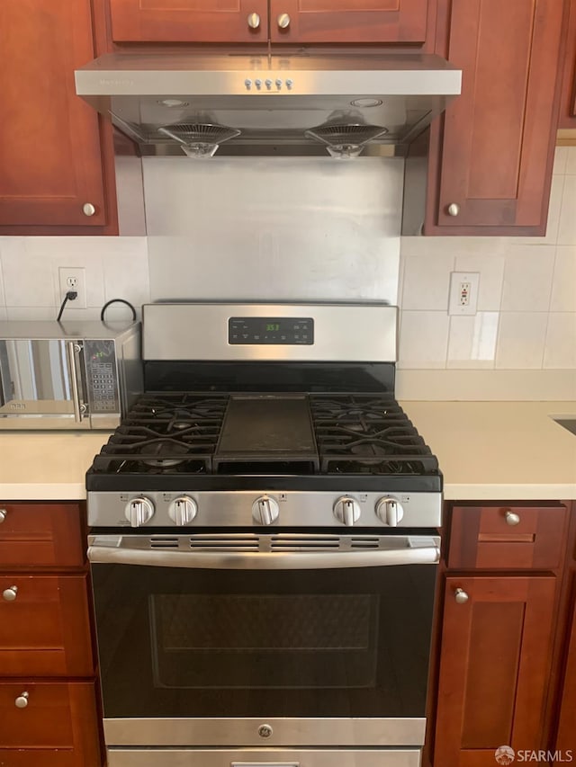3-5 Sonoma St, San Francisco, CA 94133 - kitchen featuring stainless steel appliances, exhaust hood, light countertops, and decorative backsplash