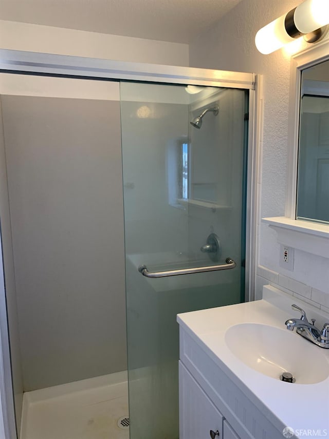 3-5 Sonoma St, San Francisco, CA 94133 - full bath featuring a stall shower, vanity, and a textured wall