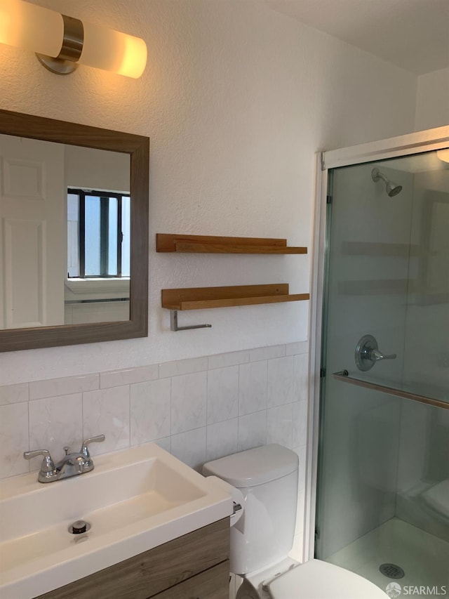 3-5 Sonoma St, San Francisco, CA 94133 - full bathroom with a shower stall, toilet, tile walls, vanity, and wainscoting