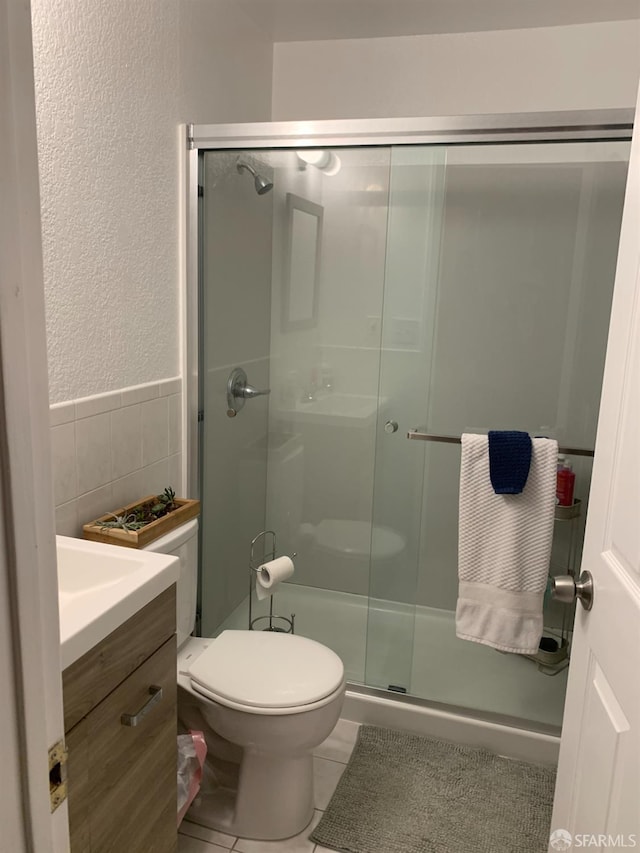 3-5 Sonoma St, San Francisco, CA 94133 - full bath featuring tile walls, a shower stall, a textured wall, toilet, and vanity