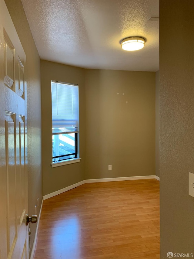 3-5 Sonoma St, San Francisco, CA 94133 - spare room featuring a textured ceiling, wood finished floors, and baseboards