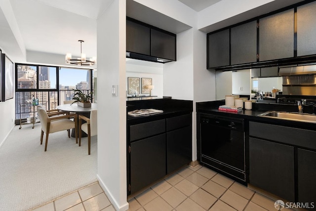 kitchen with dark countertops, light colored carpet, dishwasher, dark cabinetry, and a sink