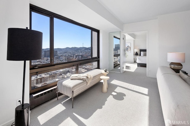 interior space with a city view and carpet floors