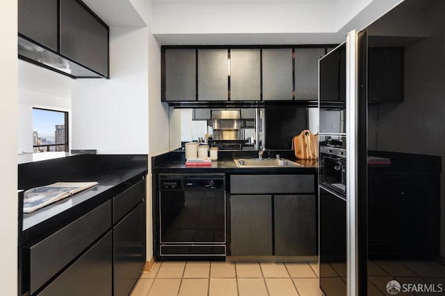 kitchen featuring black appliances, light tile patterned floors, dark countertops, and a sink