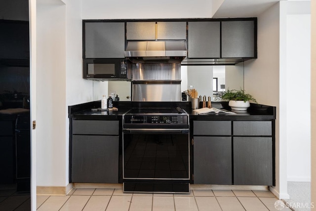 kitchen with ventilation hood, baseboards, gray cabinetry, black appliances, and dark countertops