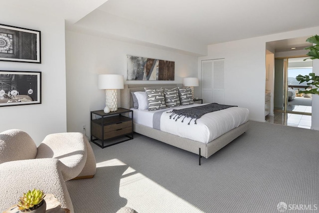 bedroom featuring a closet and carpet floors