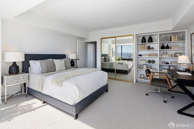 carpeted bedroom featuring a closet