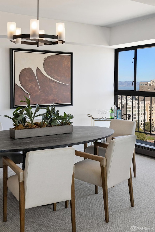 carpeted dining room featuring a baseboard radiator