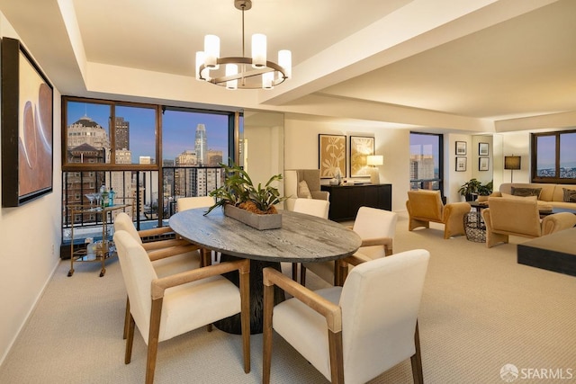 dining area with a notable chandelier, a view of city, baseboards, and carpet floors