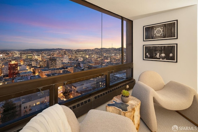 interior space with a wall of windows and a view of city