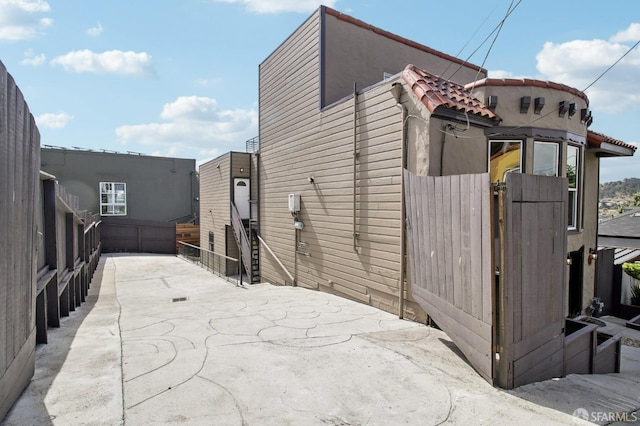 view of outdoor structure featuring fence and a gate