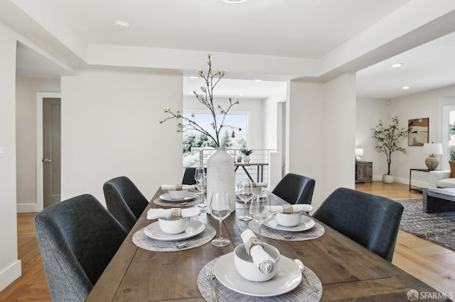 dining room featuring recessed lighting and baseboards