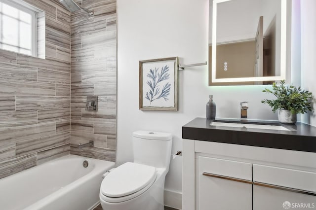 full bathroom featuring toilet, vanity, and  shower combination